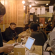 A businesswoman gives a restaurant employee a tip.